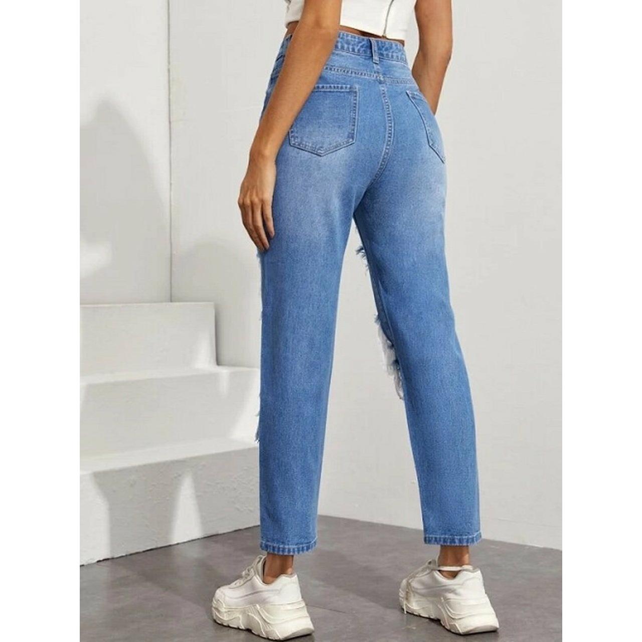 High waisted light blue ripped straight leg jeans